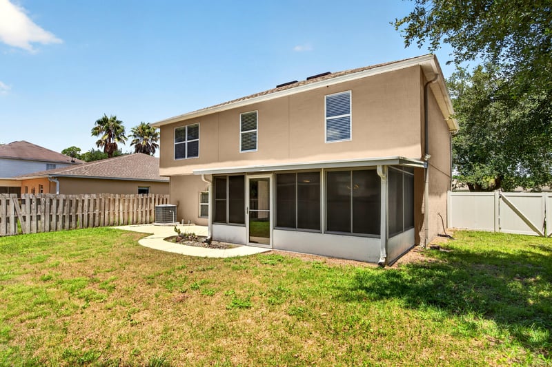 Back exterior with patio and screened porch at 3428 Glenn Hollow Ct, Jacksonville, FL 32226