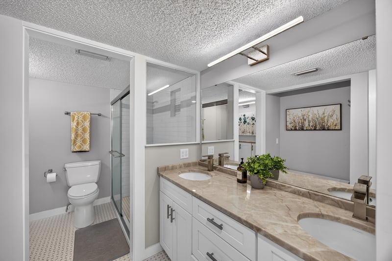 Bathroom with dual-sink vanity and mirror at 2280 Shepard St