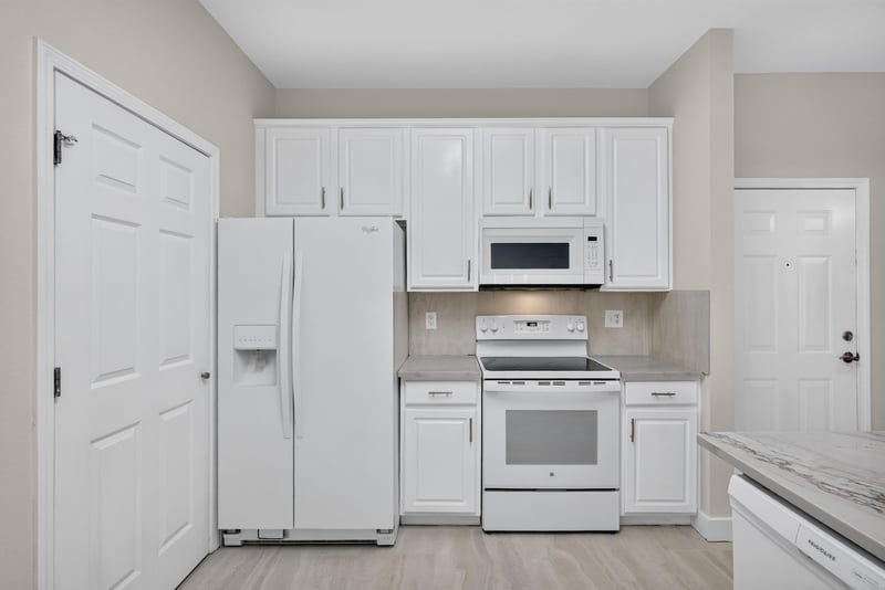 Kitchen with white refrigerator and microwave at 11251 Campfield Dr unit 1202, Jacksonville, FL 32256