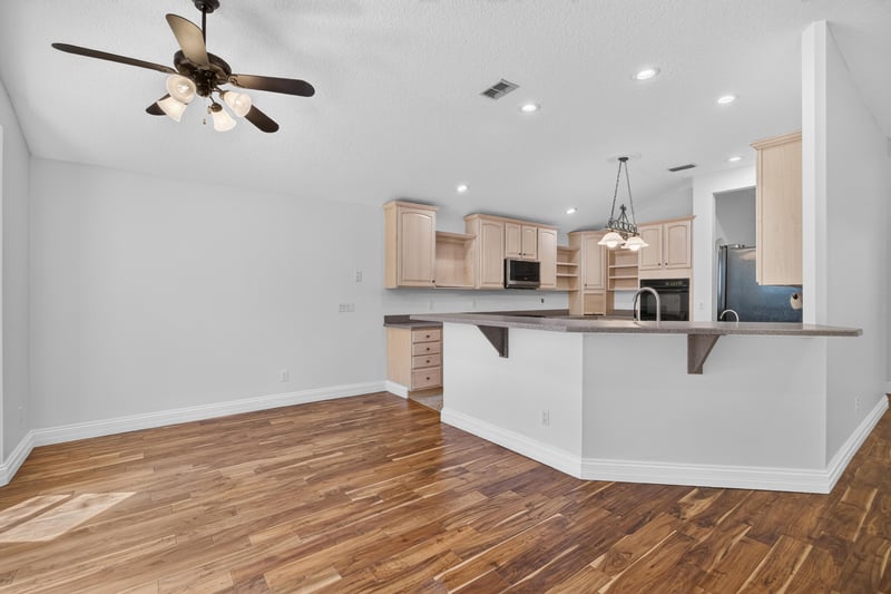 Kitchen island and breakfast bar at 11675 Magnolia Estates Rd, Jacksonville, FL 32223