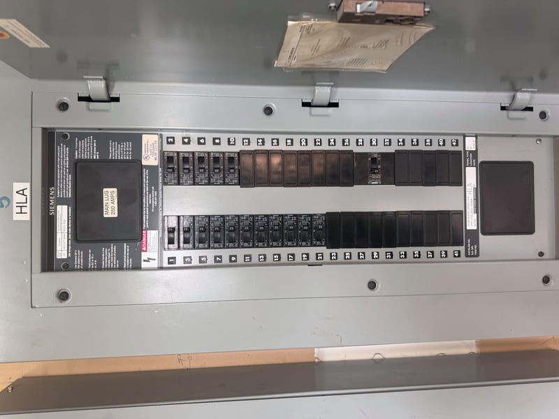 Open panel labeled HLA with circuit breakers at 11700 New Kings Rd, Jacksonville, FL 32219
