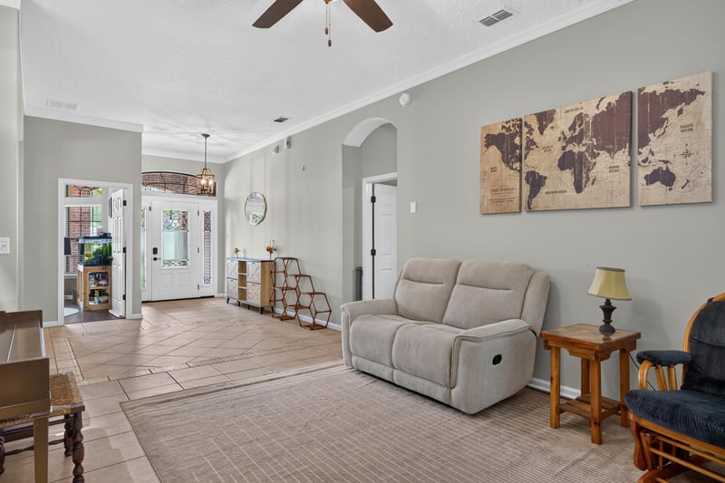 Living room with sofa and recliner at 2125 Blue Heron Cove Dr, Orange Park, FL 32003