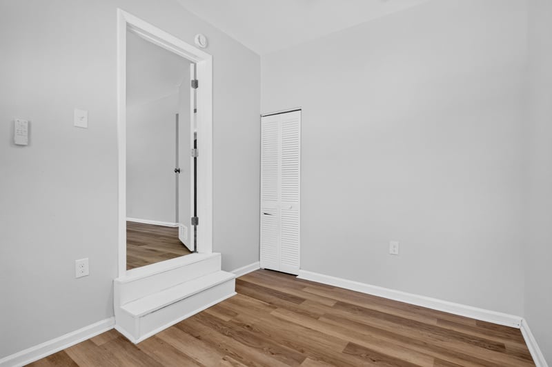 Room with doorway and wood-look flooring at 855 Cornwallis Dr, Jacksonville, FL