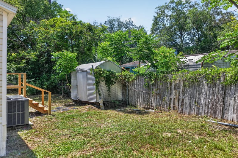 Backyard with shed, fence and AC unit at 7603 Coach Park Dr, Jacksonville, FL 32244