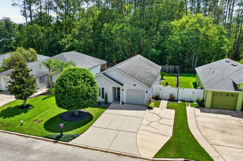 Drone aerial of home and surrounding yard at 3067 Wavering Ln, Middleburg, FL 32068