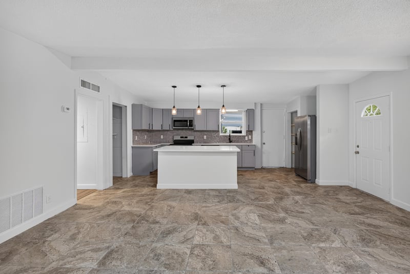 Kitchen view toward living area with stainless appliances at 3113 Kline Rd, Jacksonville, FL 32246