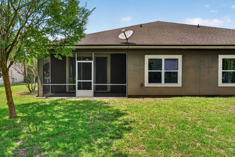 Rear exterior with screened porch at 2378 Caney Oaks Dr, Jacksonville, FL