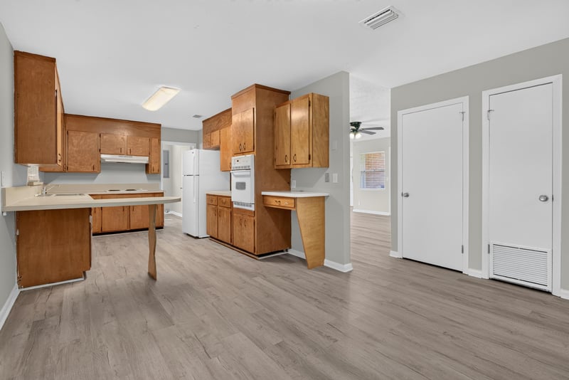 Kitchen with wood cabinets and appliances at 5503 Boeing Dr, Jacksonville, FL 32207