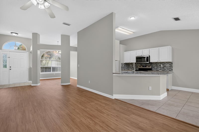Kitchen opening to the living area at 12949 Chets Creek Dr S, Jacksonville, FL 32224