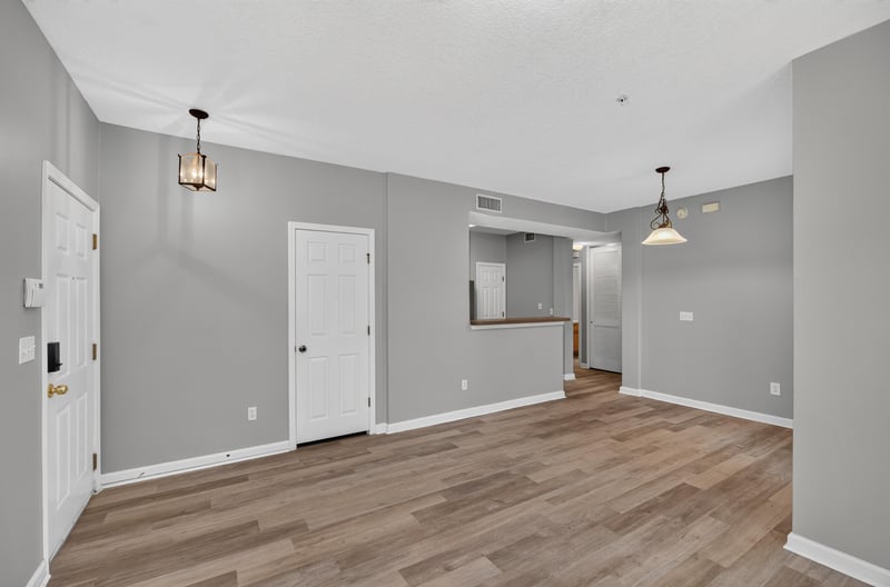 Entry hallway leading to the kitchen at 575 Oakleaf Plantation Pkwy, Orange Park, FL 32065