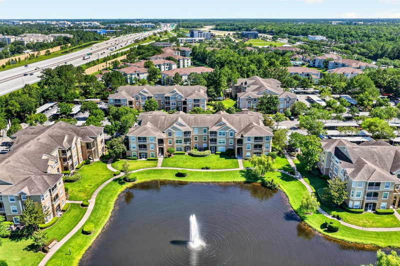 Aerial view of condo community along roadway in Jacksonville