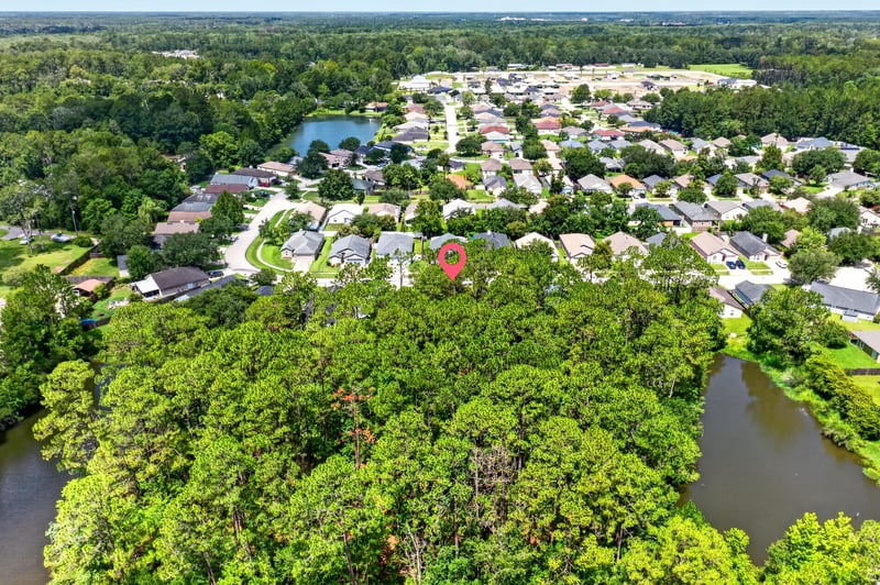 Drone aerial of the neighborhood with ponds in Middleburg, FL