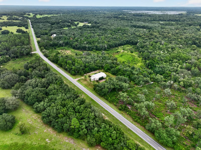 Drone aerial of the building along the county road at 1038 County Rd 315, Melrose