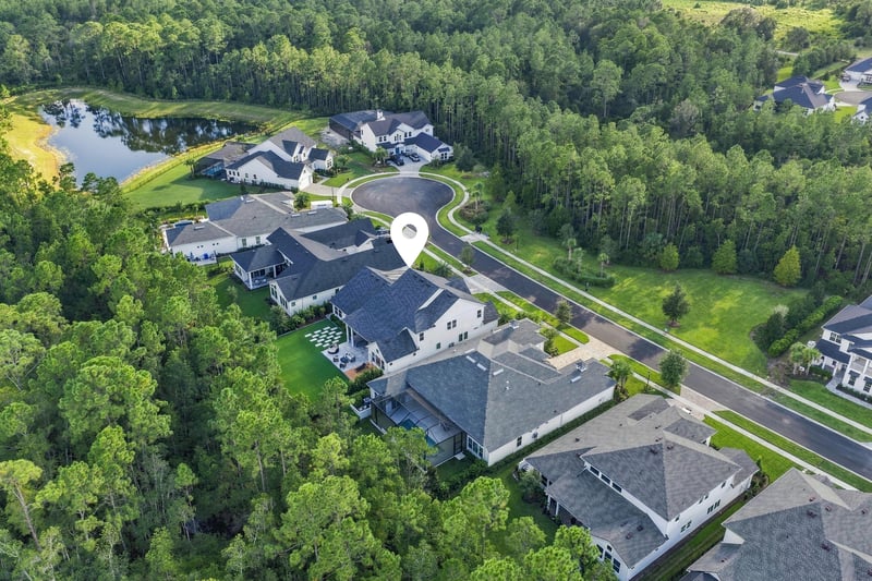 Aerial view of the street and pond beyond the neighborhood in Ponte Vedra Beach