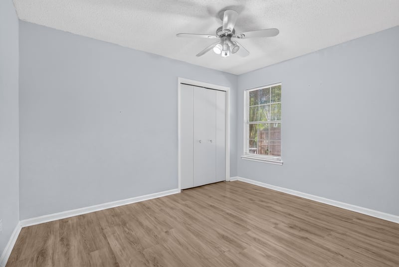 Empty room with wood flooring at 8680 Bandera Cir S, Jacksonville, FL 32244
