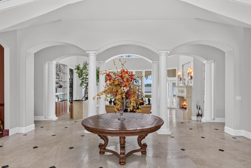 Entry hall with columns and round table at 344 Broward Rd, Jacksonville, FL