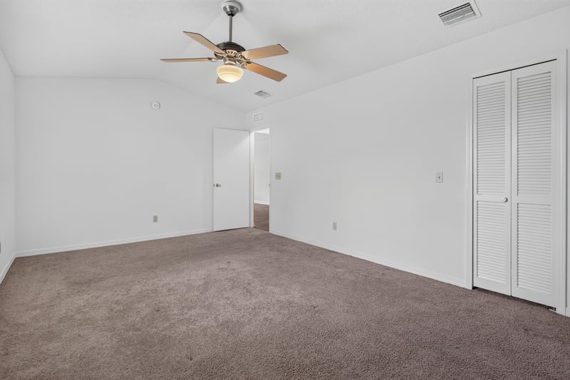Bedroom with closet and ceiling fan at 1445 Classic Oak Rd W, Jacksonville, FL