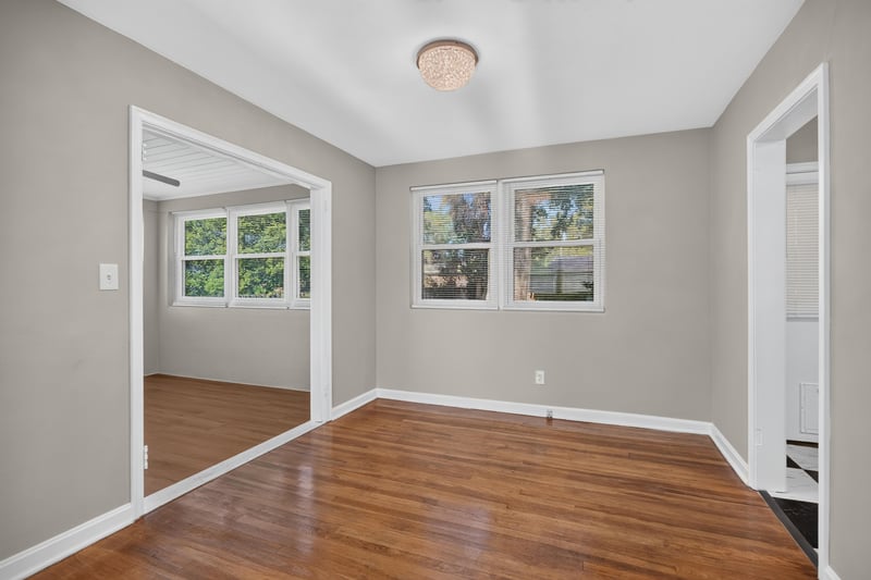 Room with pass-through opening and hardwood floors at 6338 Mercer Cir W, Jacksonville, FL