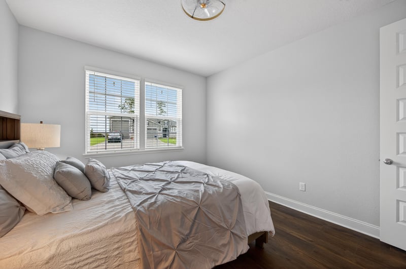 Bedroom with large window at 85491 Fall River Pkwy, Fernandina Beach, FL 32034