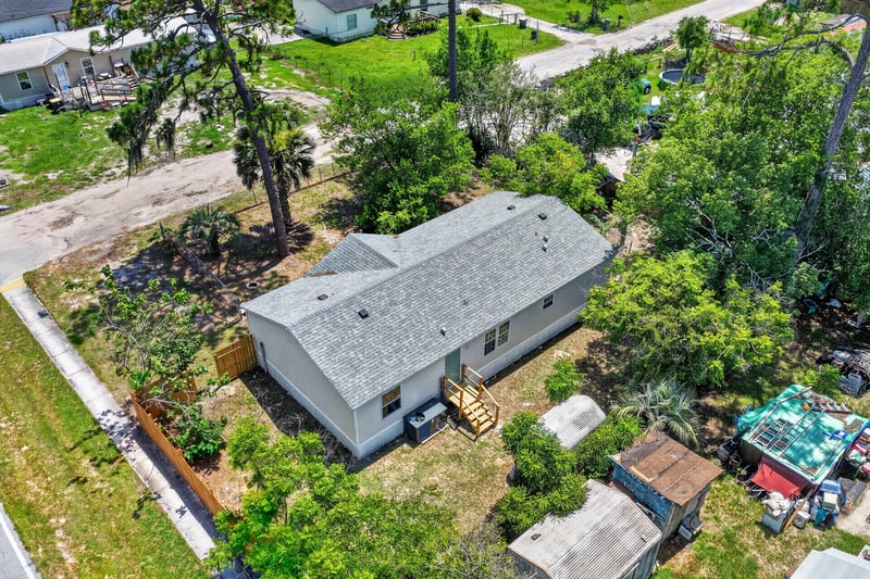 Aerial view of side yard and neighboring homes at 7603 Coach Park Dr, Jacksonville, FL 32244