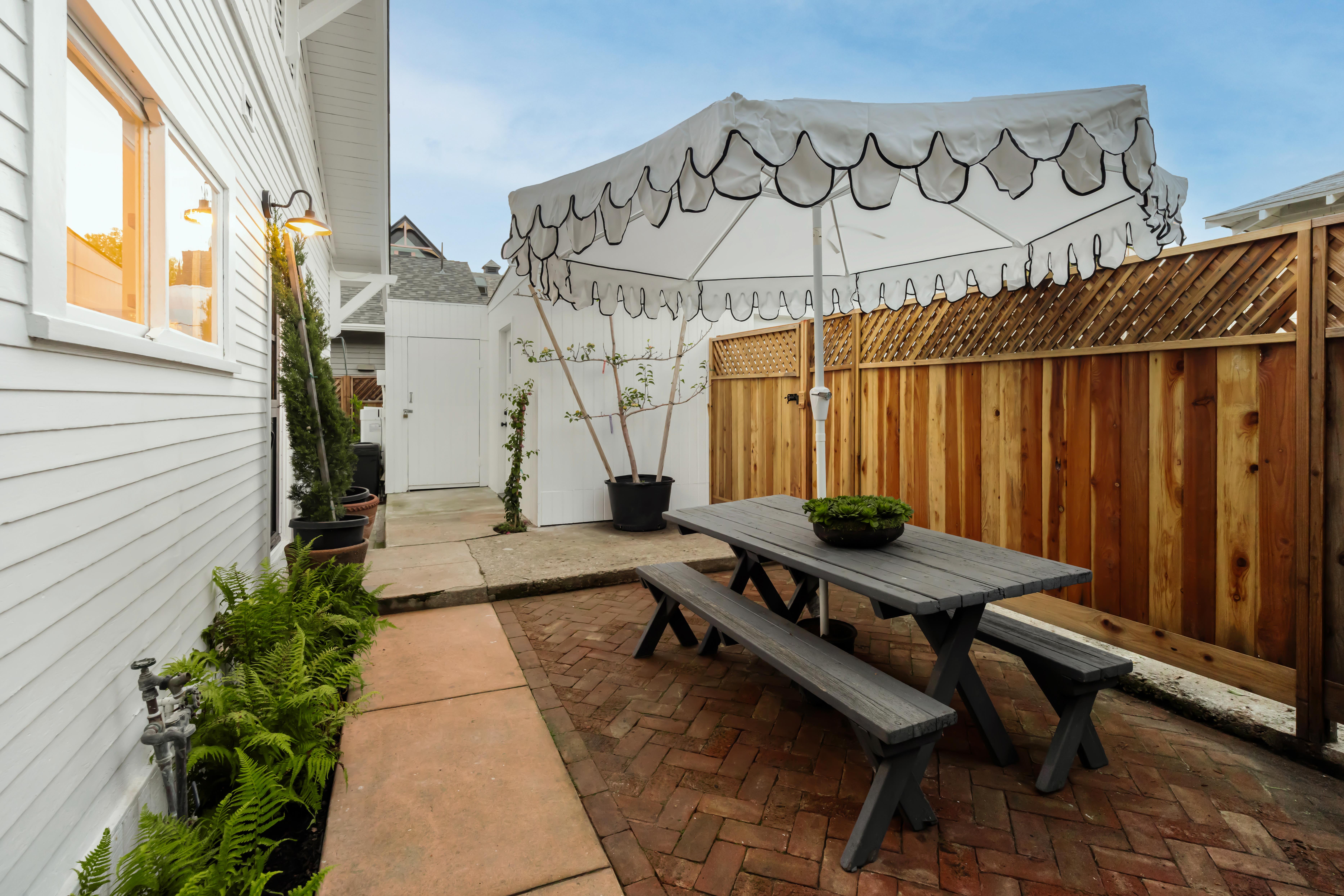 Real estate drone photography of 1508 De La Vina St, Santa Barbara — rooftop and streetscape perspective near the American Riviera