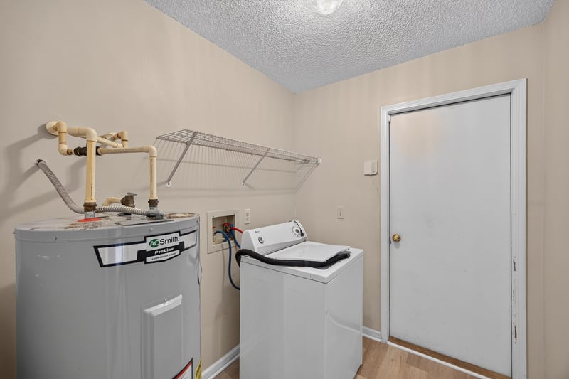Laundry closet with water heater and washer-dryer hookups at 6646 Shiloh Creek Dr