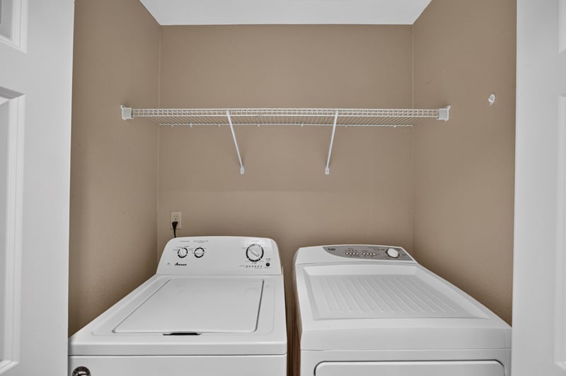 Laundry closet with shelving at 1478 Riverplace Blvd 1904, Jacksonville, FL 32207