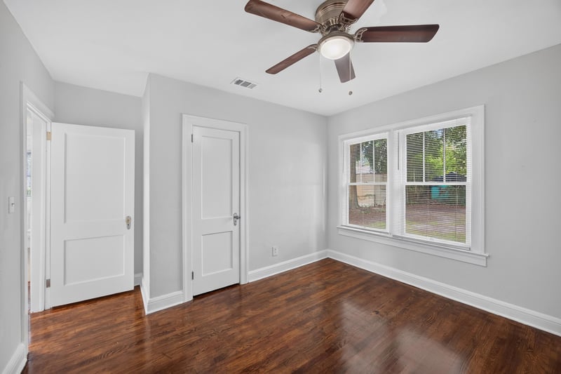 Bedroom with closet doors and windows at 316 W 41st St, Jacksonville, FL 32206