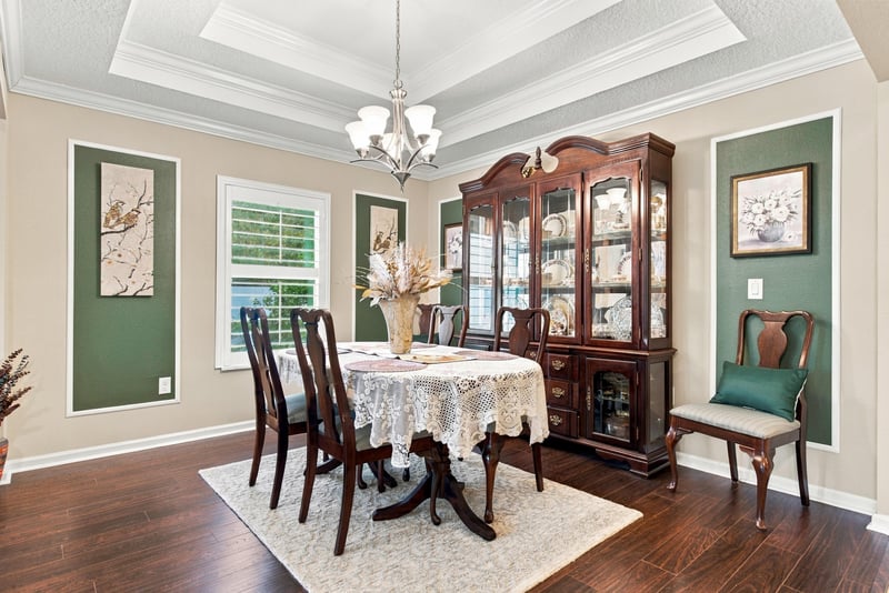 Dining room with china cabinet and chandelier at 10923 Black Diamond Ct, Jacksonville, FL