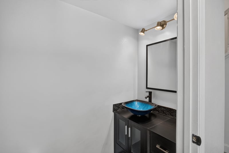 Bathroom with vessel sink and dark cabinet at 3428 Glenn Hollow Ct, Jacksonville, FL 32226