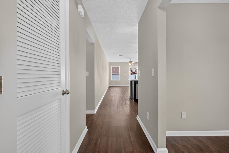Hallway with wood-look flooring at 7253 Townsend Village Ct, Jacksonville, FL