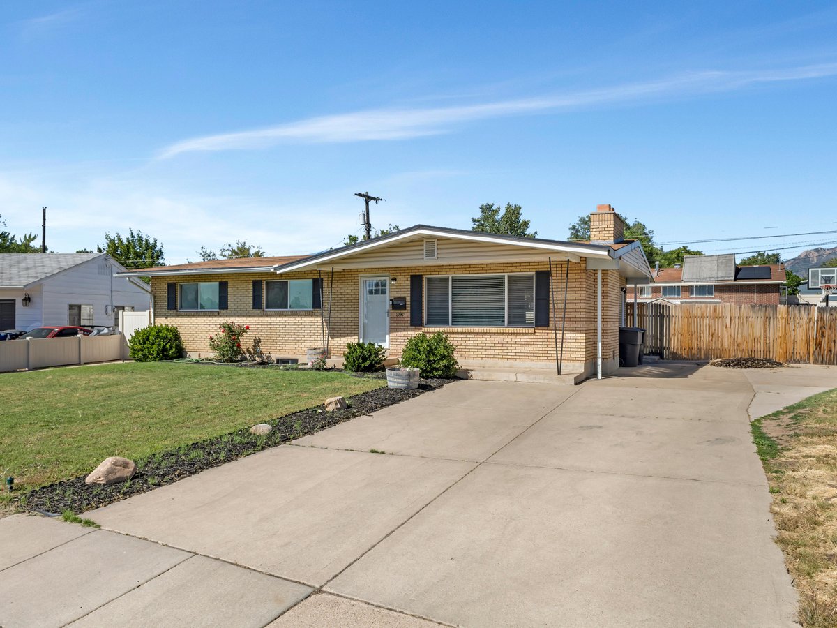 Front exterior of 396 W 1130 N — all-brick rambler in Sunset, Utah