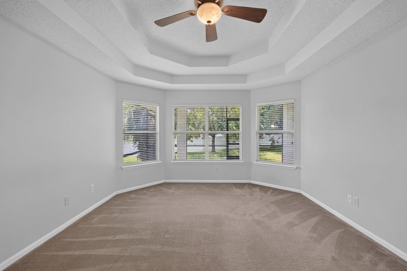 Bedroom with bay window and carpet flooring at 2480 Ridge Will Dr, Jacksonville, FL 32246