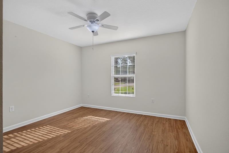 Bedroom with ceiling fan and window at 95221 Siena Ct, Fernandina Beach, FL 32034