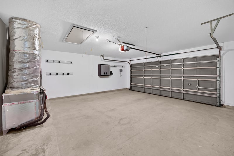 Garage interior with utility equipment at 1955 GUARDED Way, Fleming Island, FL 32003
