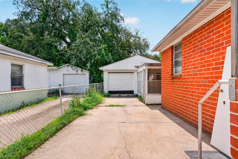 Side exterior with driveway and carport at 450 E 46th St, Jacksonville, FL 32208