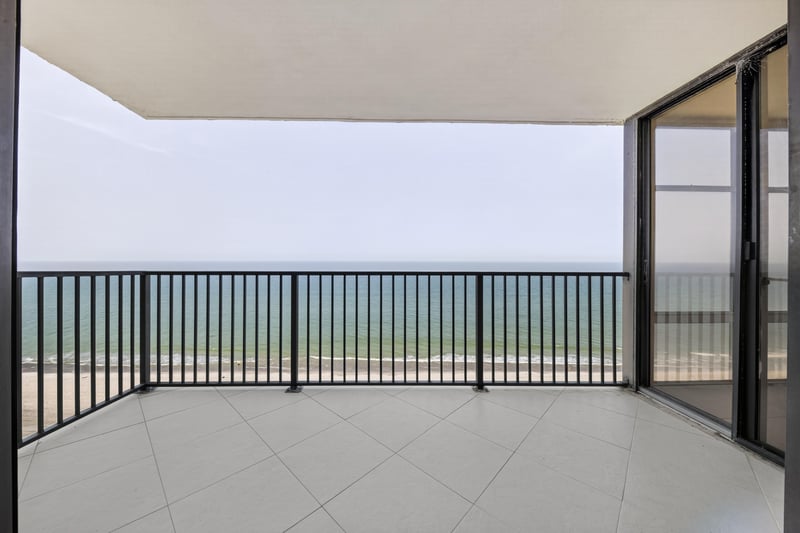 Tiled balcony with railing and ocean view at 1301 1st St S