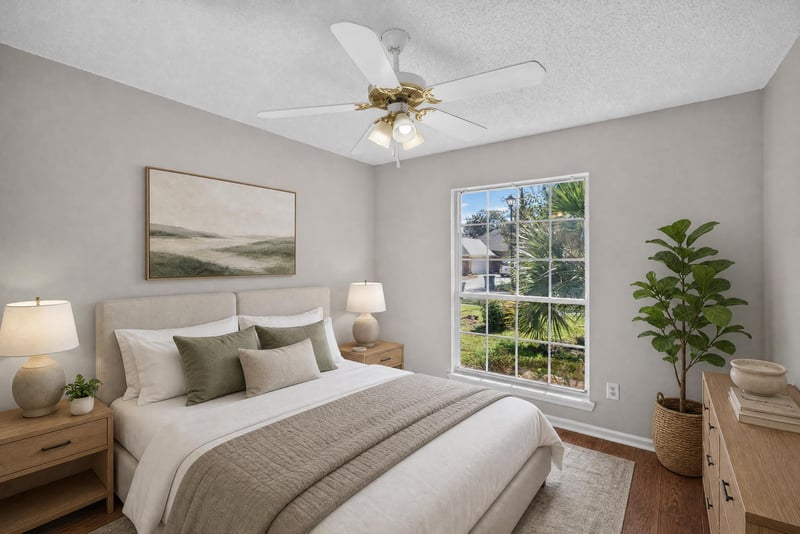 Bedroom with window and wall art at 11828 Heather Grove Ln, Jacksonville, FL