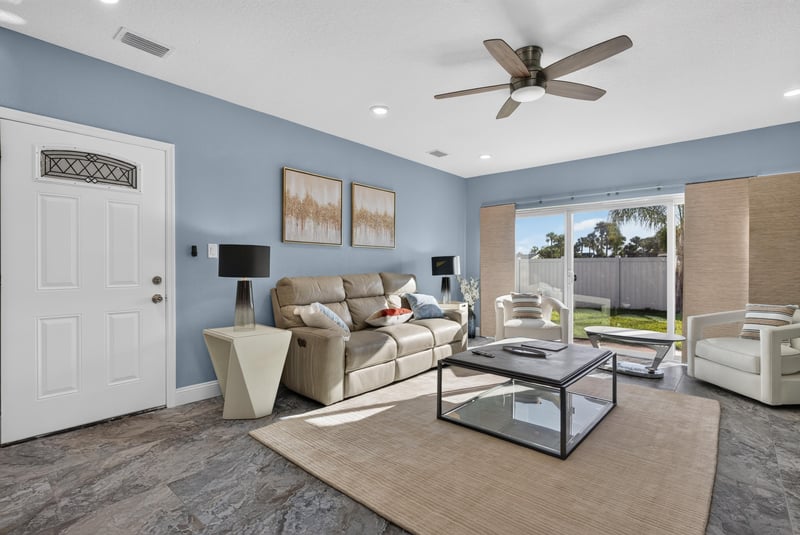 Living room with front door and wall art at 1525 8th St N, Jacksonville Beach, FL