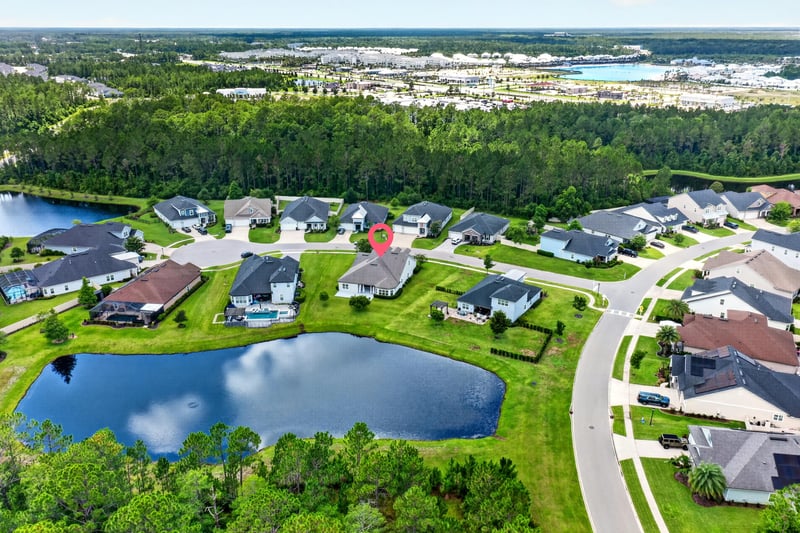 Aerial view of pond and surrounding homes in St. Augustine, FL