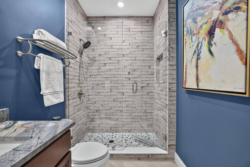 Bathroom with tile shower and towel bar at 140 Ave De La Mer, Palm Coast, FL 32137