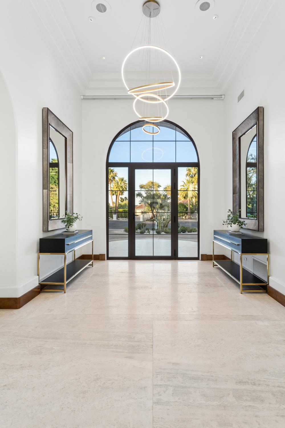 Foyer with steel-framed glass front door after renovation, Paradise Valley