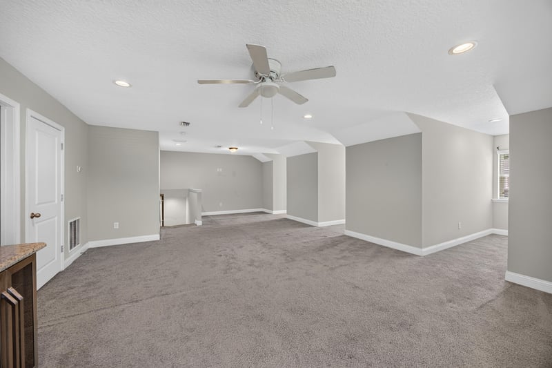 Empty bonus room with ceiling fan and carpet at 53 Lumen Ct, St. Augustine, FL 32095