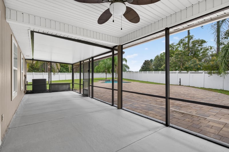 Screened porch with paver floor at 706 Grampian Highlands Dr, St. Johns, FL 32259
