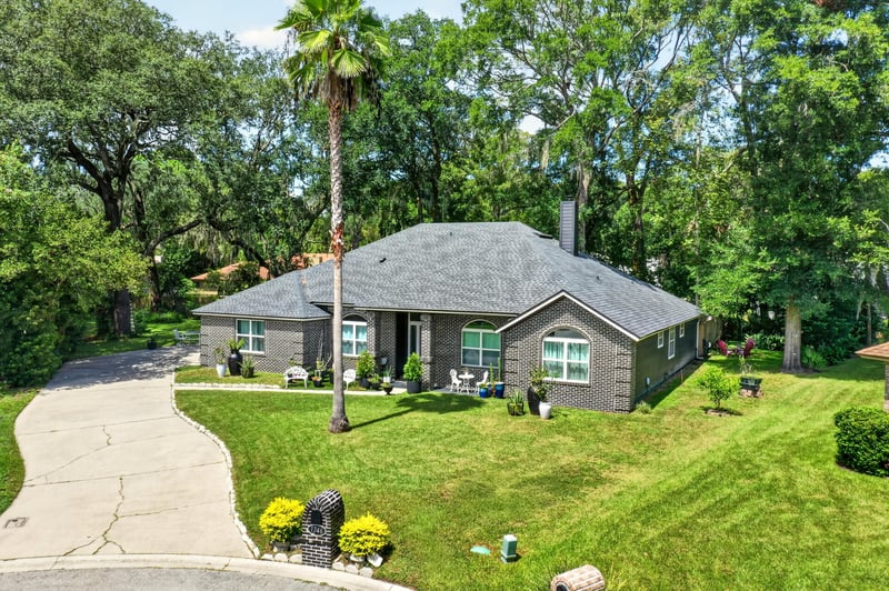 Aerial view of the brick ranch home on its cul-de-sac lot at 1346 Gately Ct, Jacksonville, FL 32225