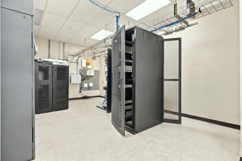 Server room with equipment racks at 101 Scholars Wy