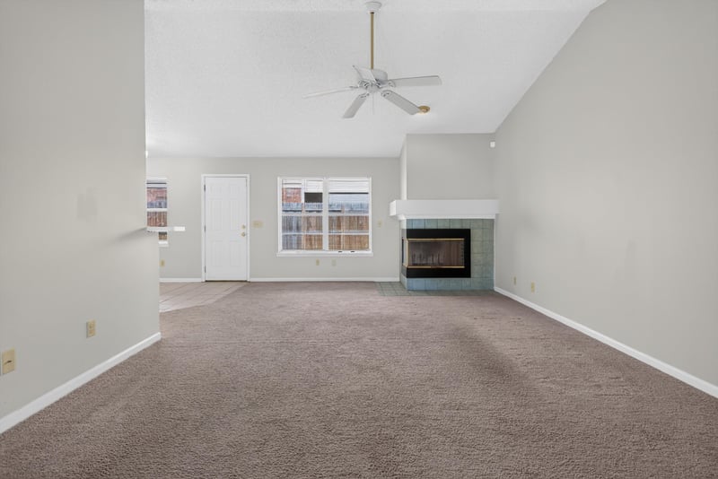 Living room with ceiling fan and fireplace at 400 Ashcroft Landing Dr, Jacksonville, FL 32225