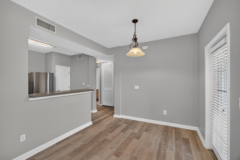 Open view from entry toward kitchen pass-through at 575 Oakleaf Plantation Pkwy, Orange Park, FL 32065