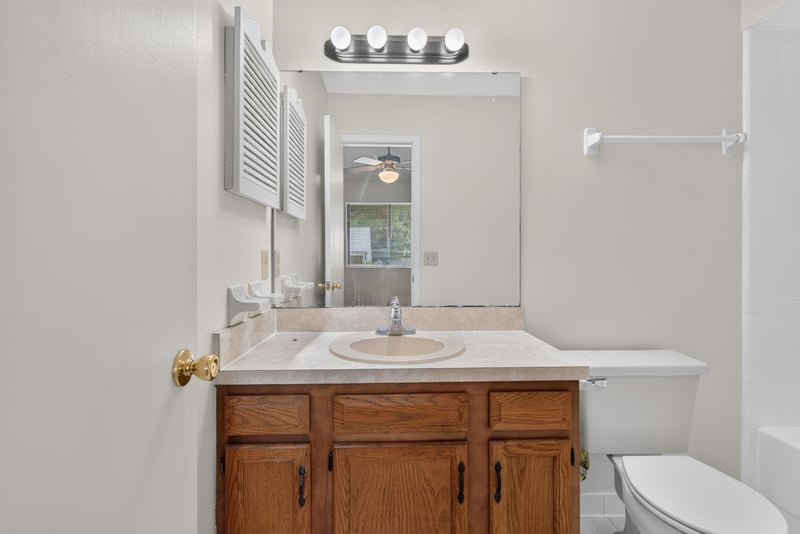 Bathroom vanity and mirror at 1445 Classic Oak Rd W, Jacksonville, FL