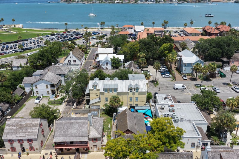 Aerial view of downtown rooftops with the bay in the background in St. Augustine, FL